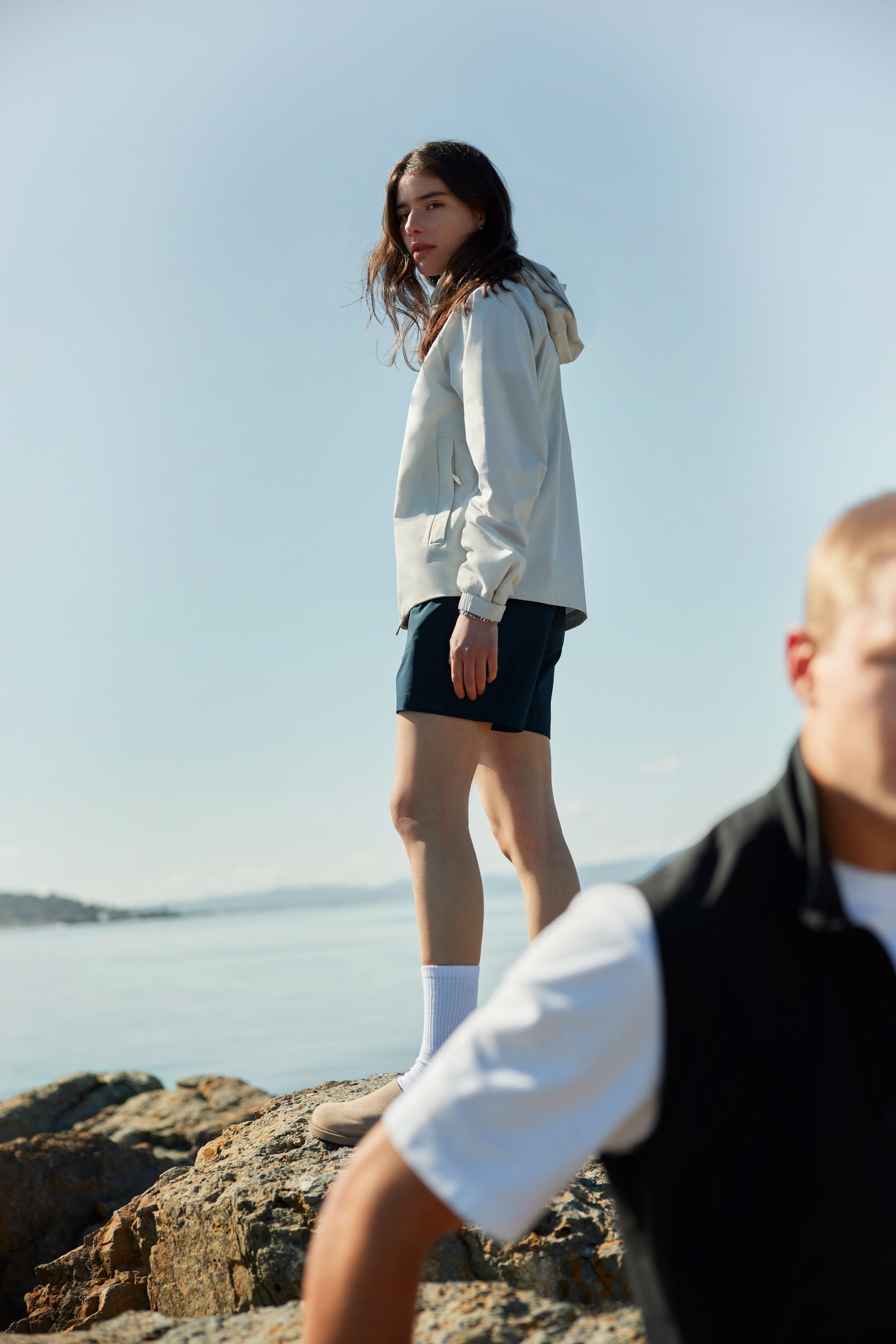 Woman wearing the Hjelle jacket and shorts from BLÆST